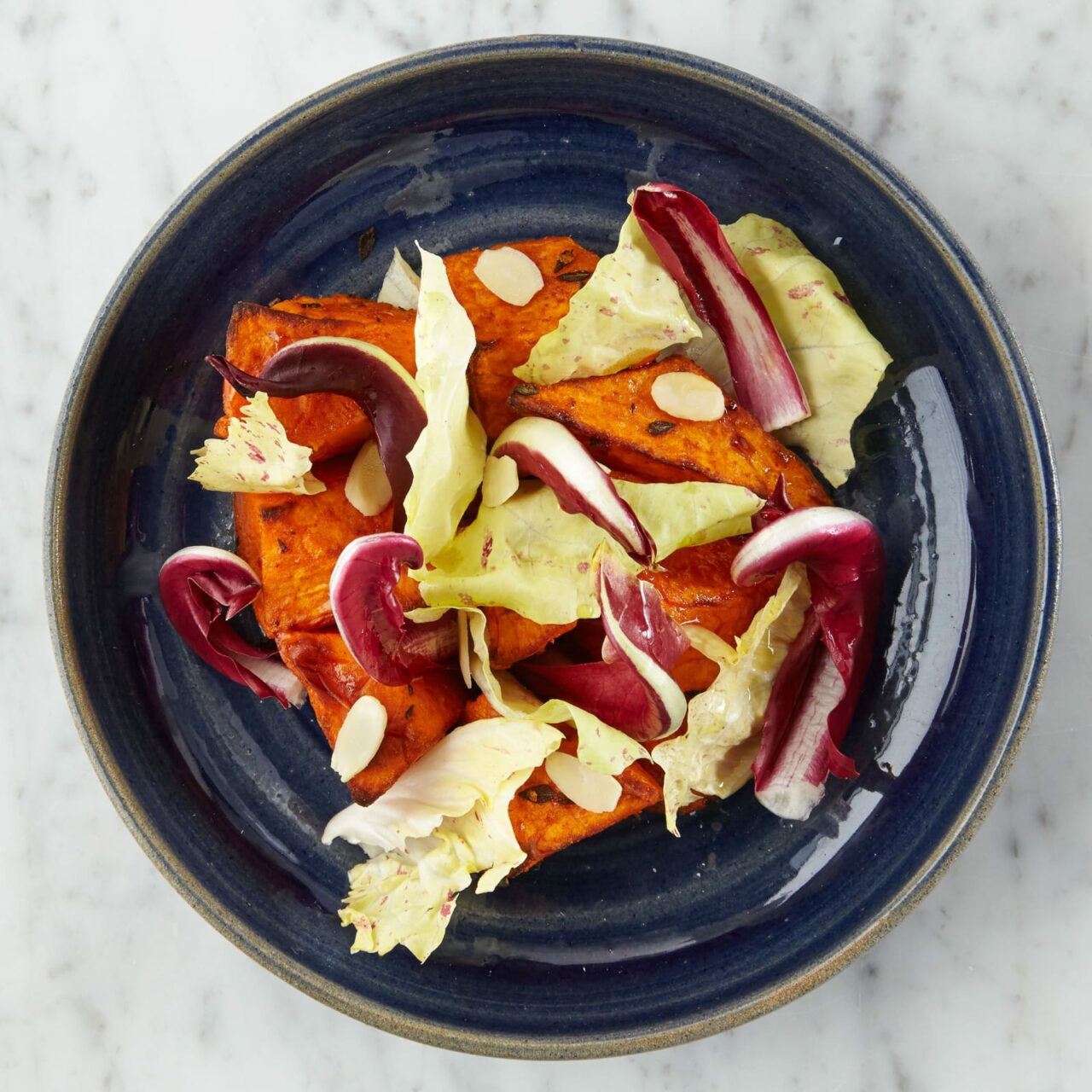 Paprika and Thyme Roasted Sweet Potatoes with Radicchio Leaves And Toasted Almonds